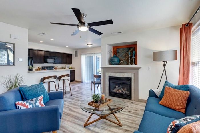 Bright living room with a gas fireplace and stylish decor at Navigator Villas in Pasco, WA.
