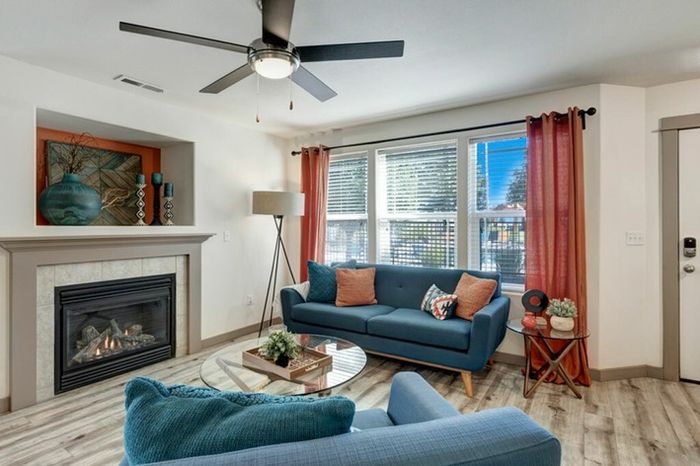 Bright living room with a gas fireplace and stylish decor at Navigator Villas in Pasco, WA.