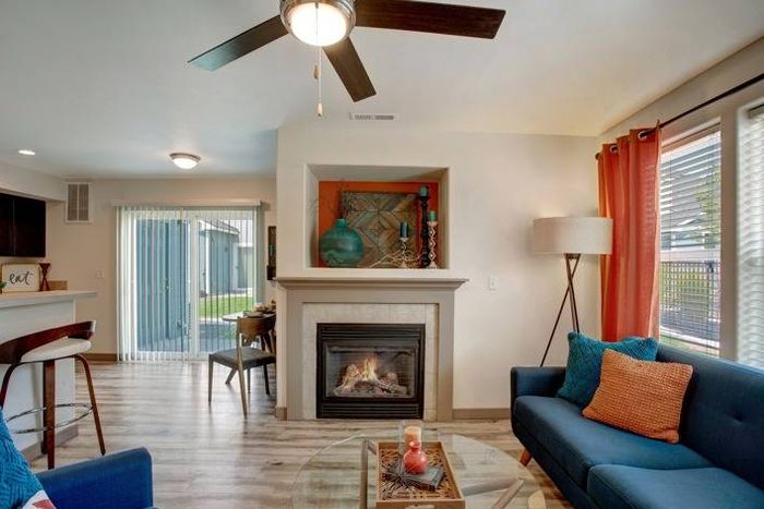 Bright living room with a gas fireplace and stylish decor at Navigator Villas in Pasco, WA.