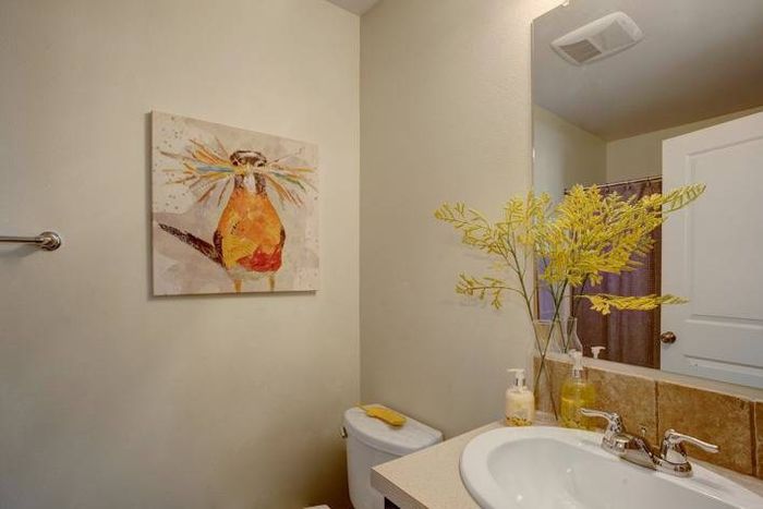 Well-lit bathroom with rustic decor and modern sink fixtures at Navigator Villas in Pasco, WA.