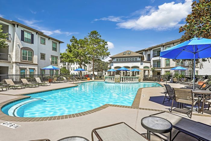 sparkling swimming pool with poolside seating