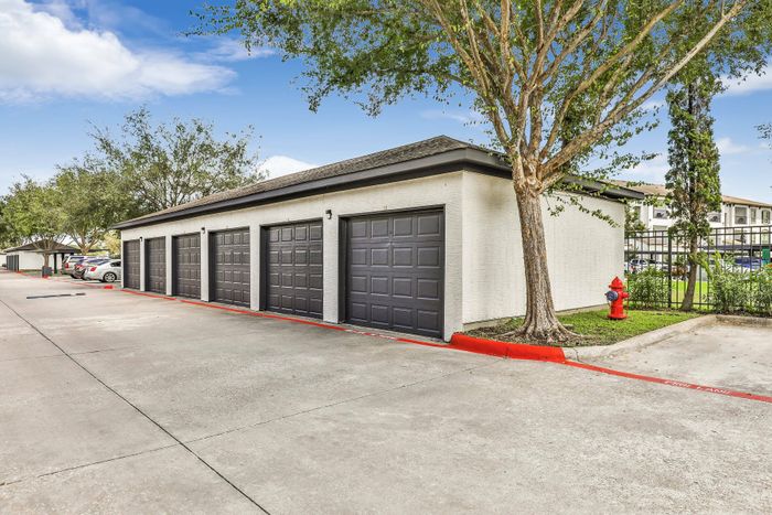 garages surrounded by clean pathways and trees