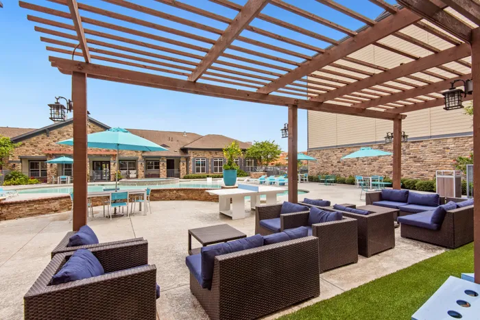 Spacious poolside lounge area at Katy Ranch Apartments in Katy, TX