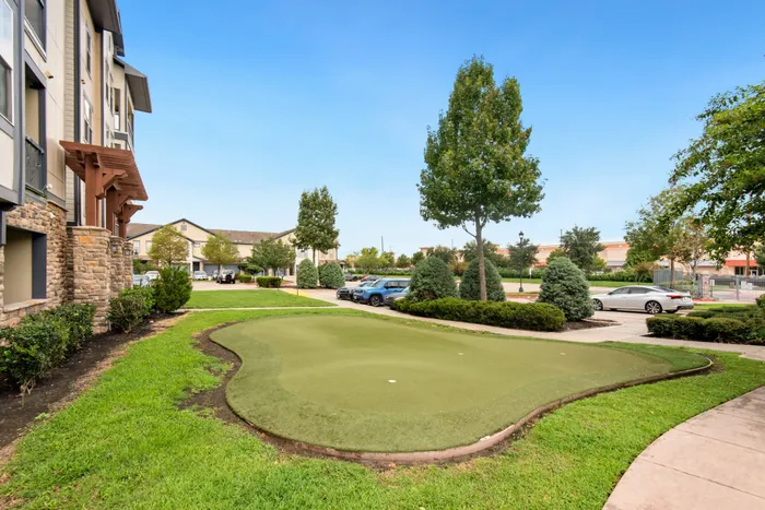 Putting green at Katy Ranch Apartments offering residents a top-tier golfing experience in Katy, TX.