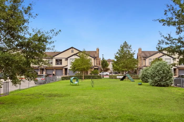 Spacious dog park at Katy Ranch Apartments in Katy, TX, designed for pets and owners.