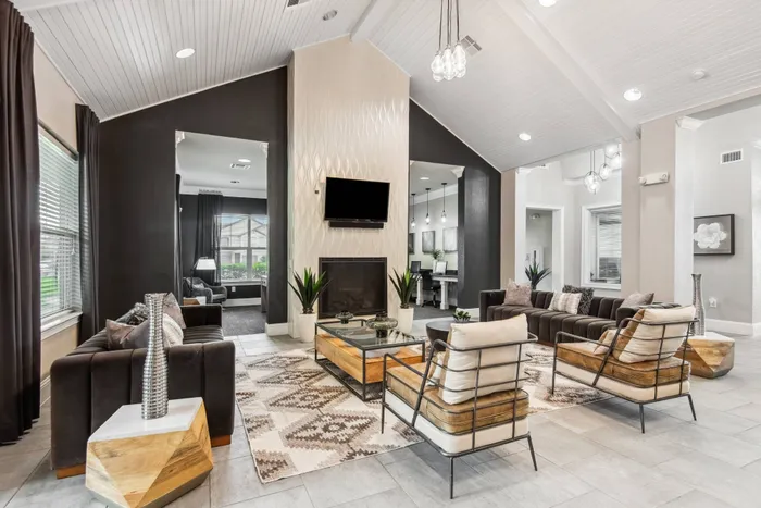Spacious Clubhouse featuring TVs, a full kitchen, and a coffee bar at Katy Ranch Apartments, Katy, TX