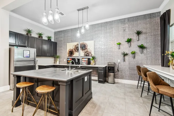 Fully equipped kitchen in the clubhouse at Katy Ranch Apartments, featuring modern appliances and stylish design in Katy, TX.