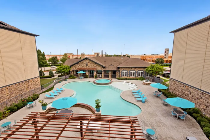 Enjoy the luxury of a resort-style swimming pool at Katy Ranch Apartments in Katy, TX