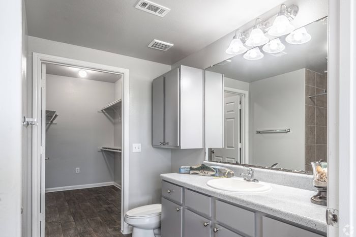 Elegant bathroom with modern fixtures and a large soaking tub at Mansions at Moses Lake, Texas City
