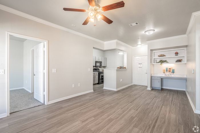 Elegant living room with modern decor and large windows at Mansions at Moses Lake, Texas City