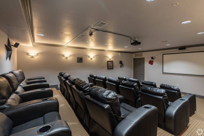 Private theater room with plush seating at Mansions at Moses Lake, Texas City, TX