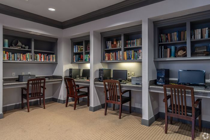 Modern business center with computers and workspace at Mansions at Moses Lake, Texas City, TX