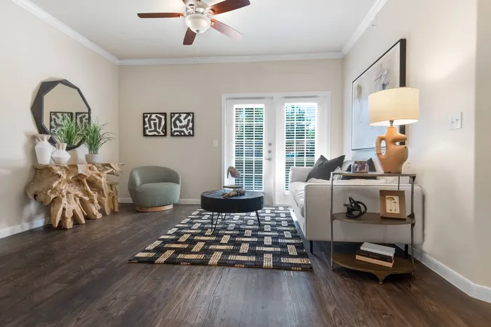 spacious living room with ceiling fan