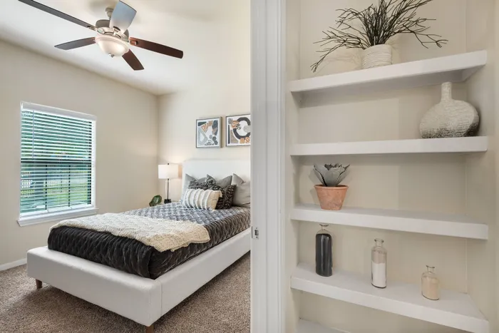 bedroom storage with ceiling fan