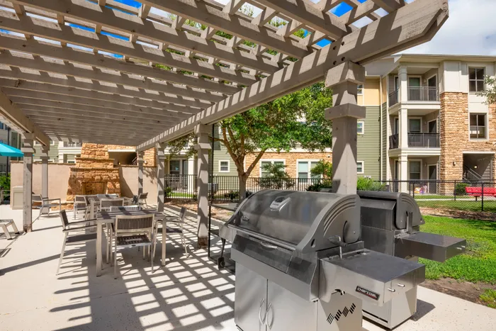 shaded outdoor seating and grill