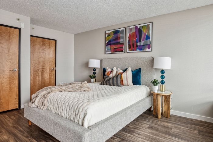 large bedroom with wooden floors
