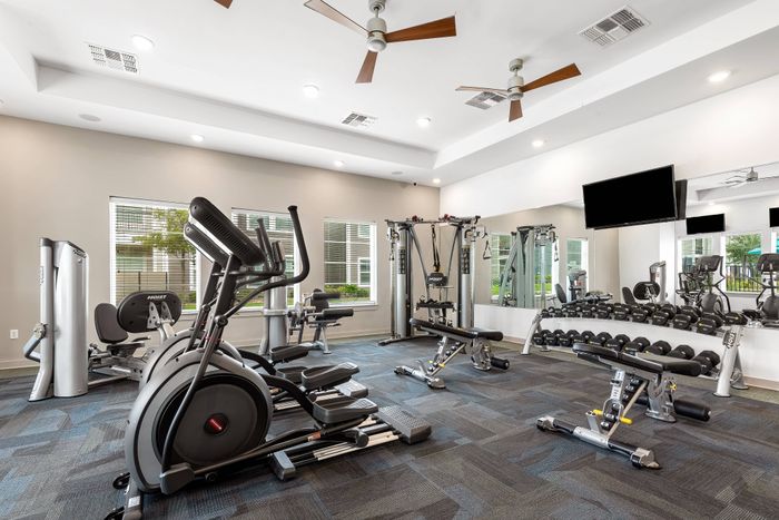 Modern fitness center at The Retreat in Corpus Christi, TX featuring advanced gym equipment.