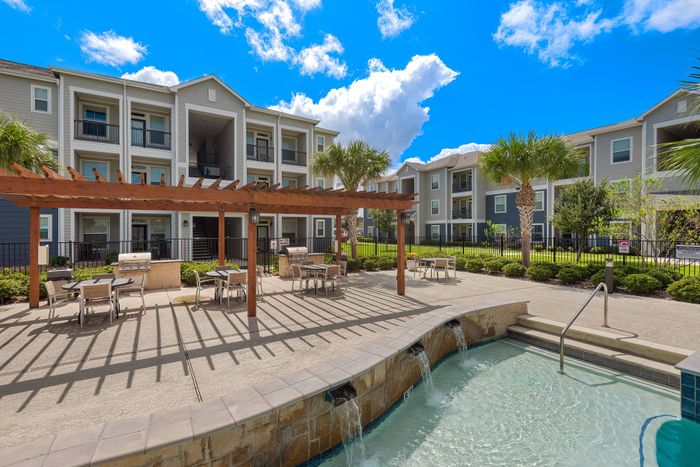 Scenic picnic area with barbecue facilities at The Retreat, Corpus Christi, TX, ideal for family and group events.