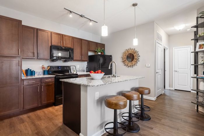 All-electric kitchen with sleek appliances at The Retreat in Corpus Christi, TX