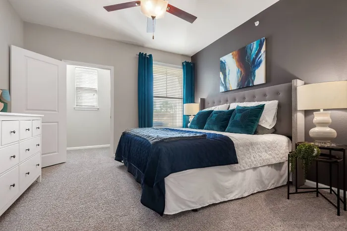 Spacious bedroom with modern decor at The Retreat in Corpus Christi, Texas