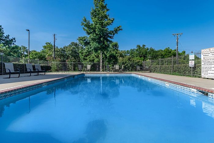 a large swimming pool with clean and clear water