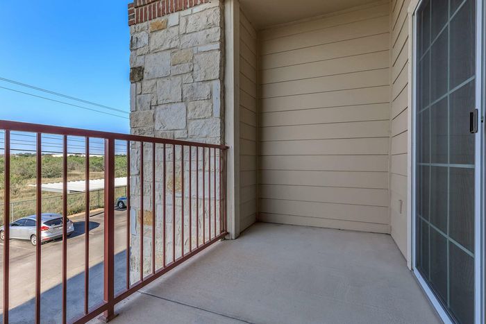 Spacious patio with plenty of room for outdoor furniture at Willowbend Apartments in San Antonio, TX.