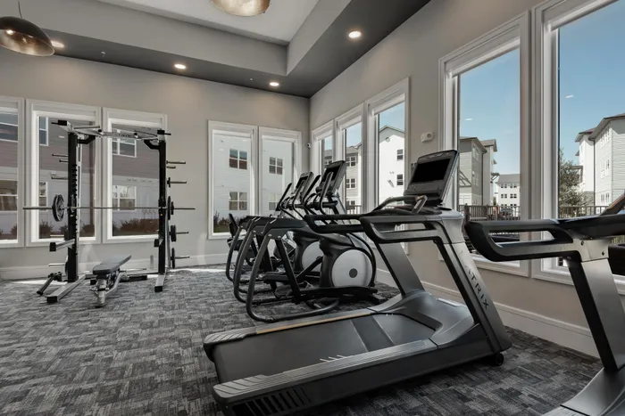 state of the art fitness center with treadmill and bikes