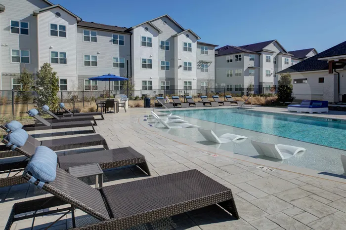 sparkiling wading pool with lounge seating