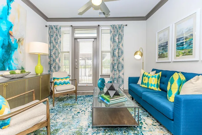 Modern apartment living room with vibrant decor, natural light, and a cozy atmosphere at Cityscape Apartments in Houston, TX.