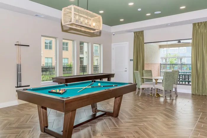 Game room featuring a billiards table, modern decor, and comfortable seating at Cityscape Apartments in Houston, TX.