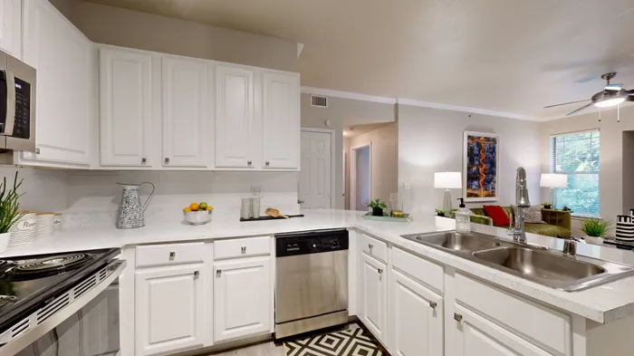 Spacious kitchen with stainless steel appliances and granite countertops at The Woods of Five Mile Creek, Dallas, TX.