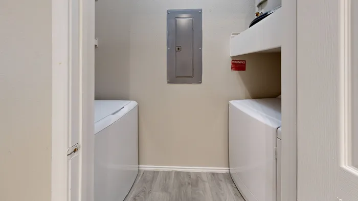 Modern washer and dryer set in a luxury apartment at The Woods of Five Mile Creek, Dallas, TX.