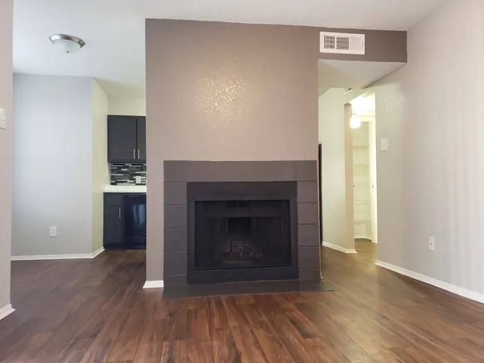 fireplace with wood style flooring