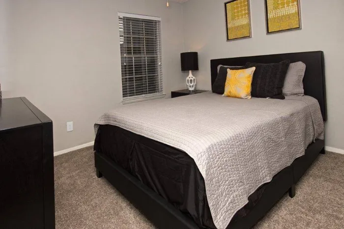 spacious bedroom with carpeting