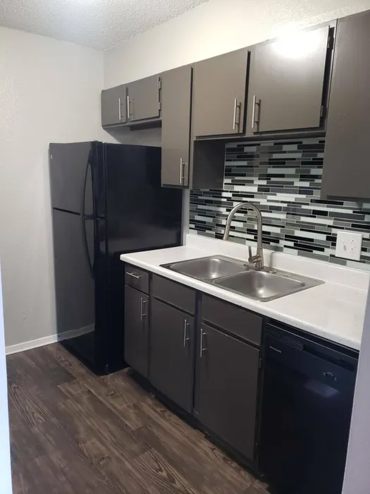 state of the art kitchen with black appliances