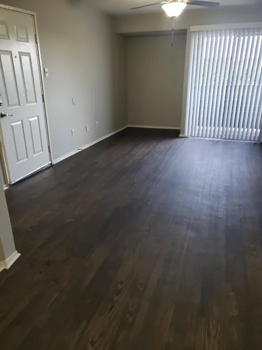 spacious living room with wood style flooring