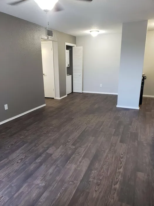 spacious living room with wood style flooring