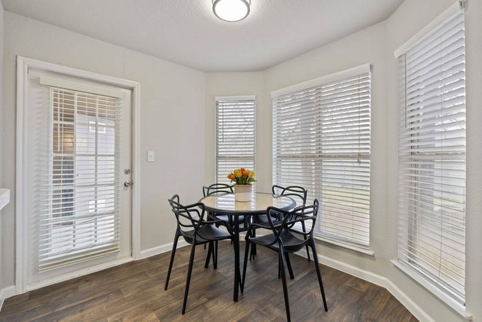 Spacious dining room at Avonmora Apartments in Austin with contemporary furnishings