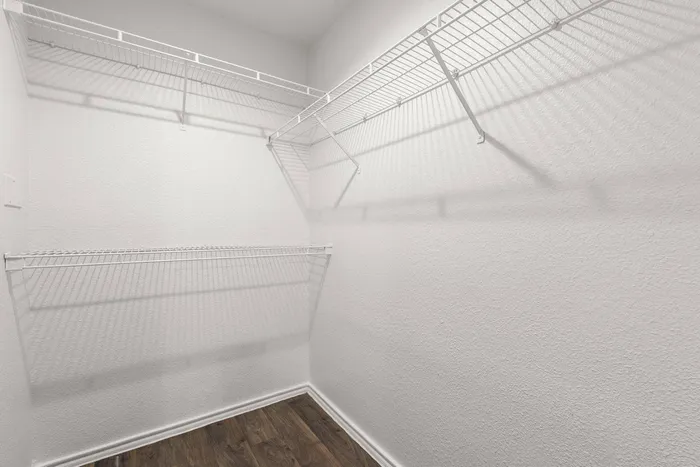 Large walk-in closet with ample storage space at Ovation Apartments in Austin, Texas