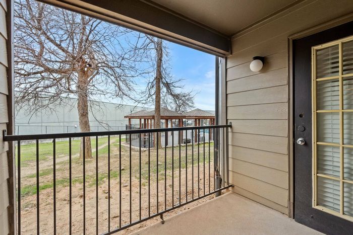 Private patio with scenic views at Ovation Apartments in Austin, Texas