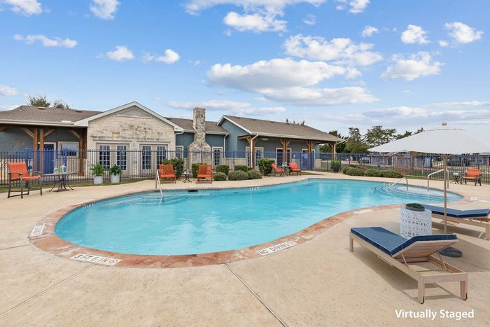 Beautiful swimming pool at Crescent Village Apartments, Elgin, TX, perfect for relaxation.