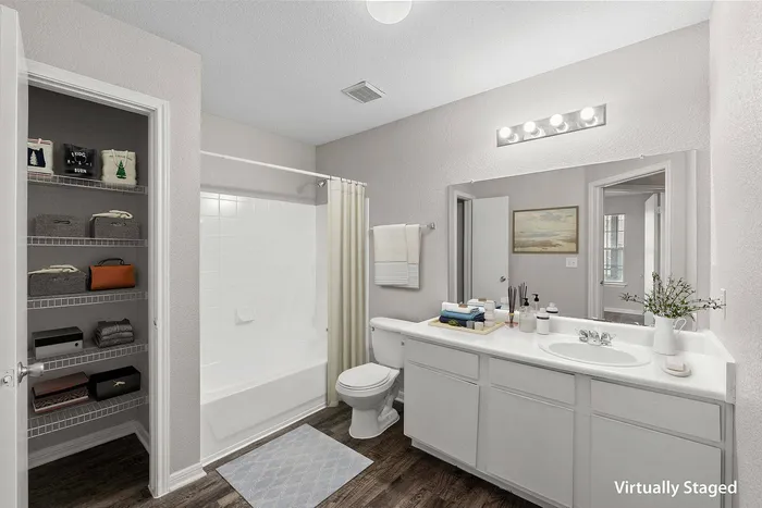 Stylish bathroom with contemporary features at Crescent Village Apartments in Elgin, TX
