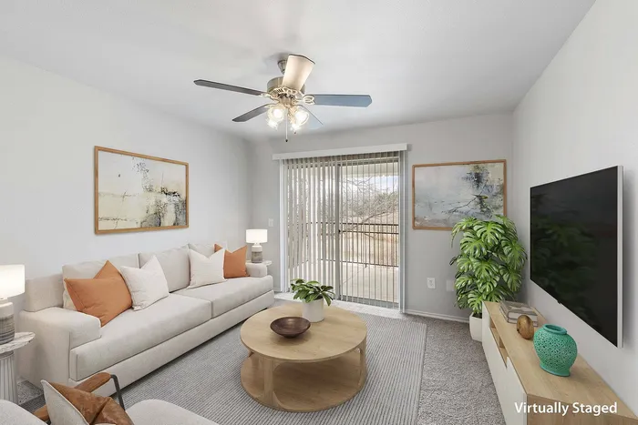 Modern living room with natural light at Fort Branch in Truman's Landing, Austin, TX