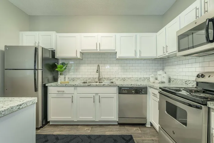 Gourmet kitchen with upgraded appliances and custom cabinetry in Avenues of Kennesaw luxury apartments