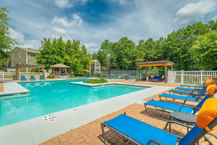 Resort-style swimming pool with lounge chairs at Avenues of Kennesaw in Georgia