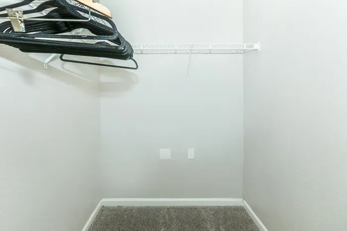 Large walk-in closet with built-in shelving at 89 East Apartments in Tulsa