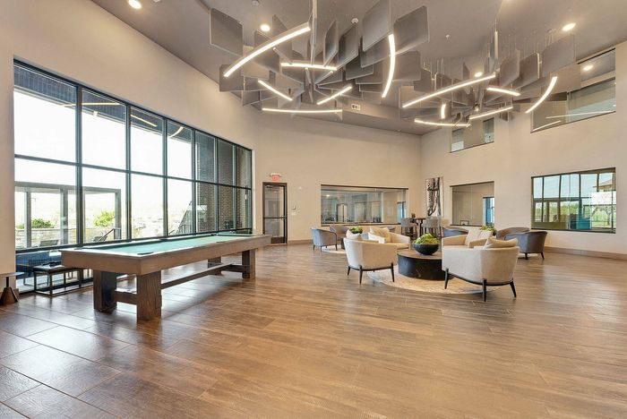 Upscale billiards room featuring a pool table and sleek design at Discovery Park in Denton, Texas.
