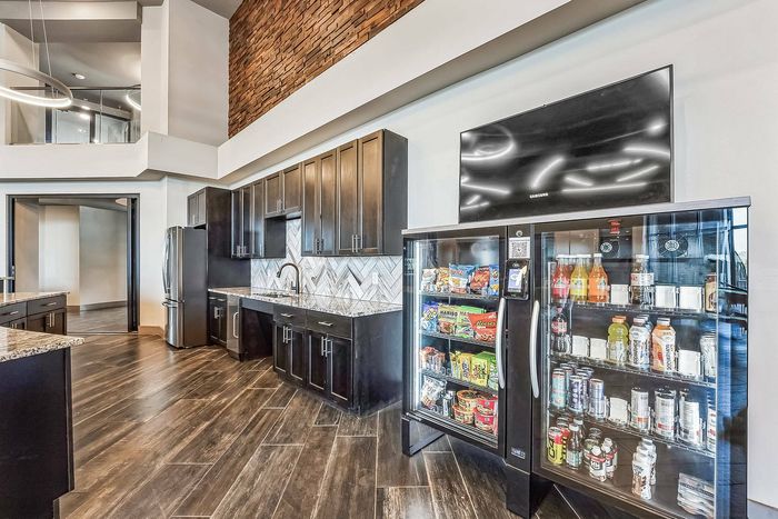 Leasing center with modern desks and large windows at Discovery Park Apartments in Denton, TX