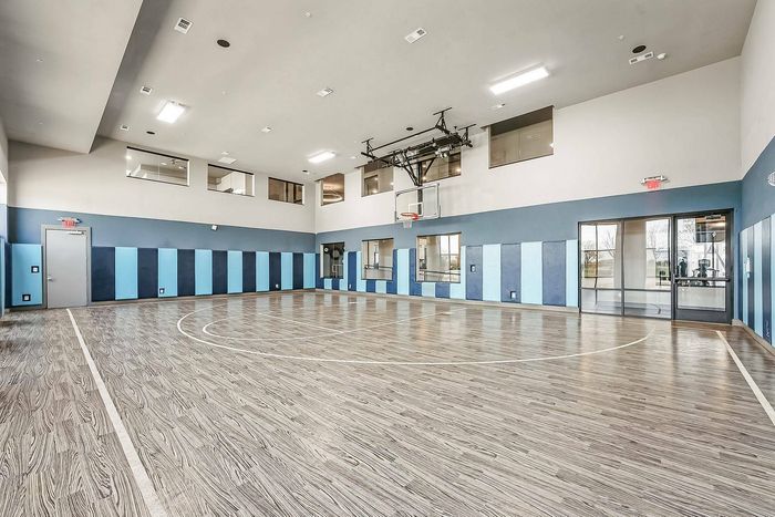 Full indoor basketball court at Discovery Park Apartments in Denton, TX