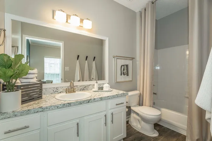 Modern bathroom with granite countertops and sleek finishes at Avenues of Kennesaw